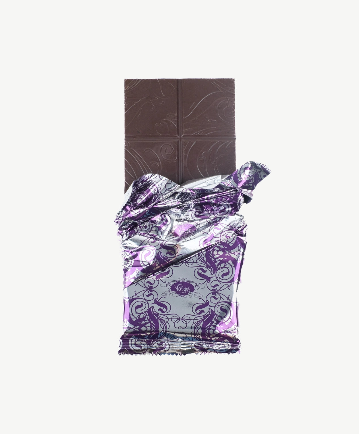 Vosges Black Salt Caramel bar unwrapped stands upright on a white background.